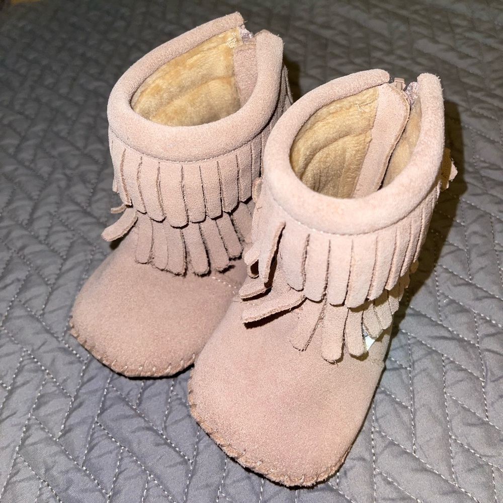 Size 3 fringe leather moccasin boot.